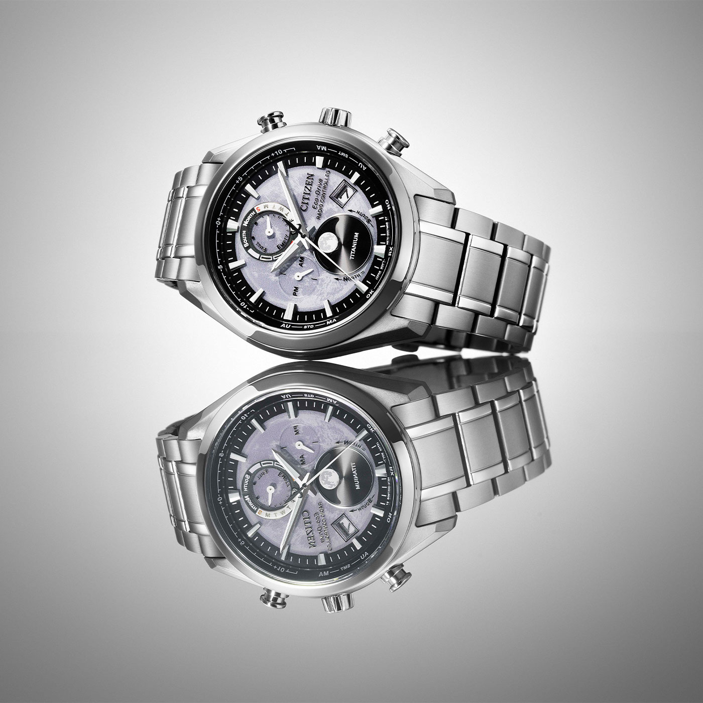 Citizen watch, titanium, Eco-Drive, radio controlled, with a reflective surface.