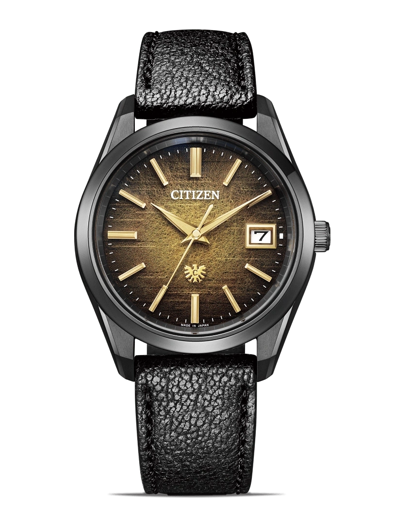Citizen watch with black leather strap and gold accents on a green background
