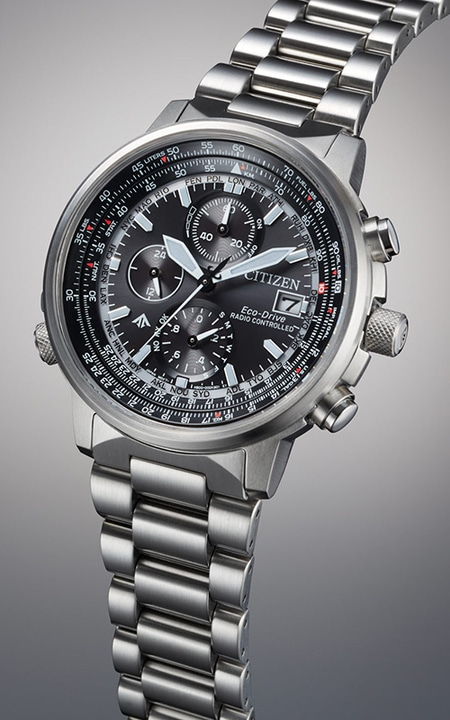 Citizen watch with black face, silver band, and multiple dials, Eco-Drive technology.