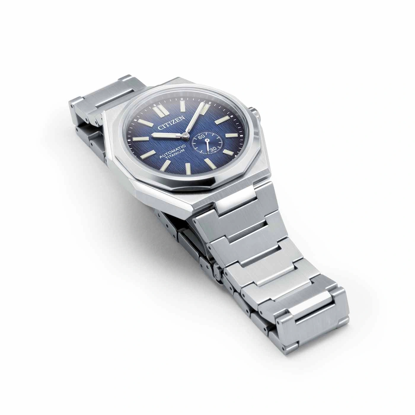 Citizen watch with blue face and silver strap on white background
