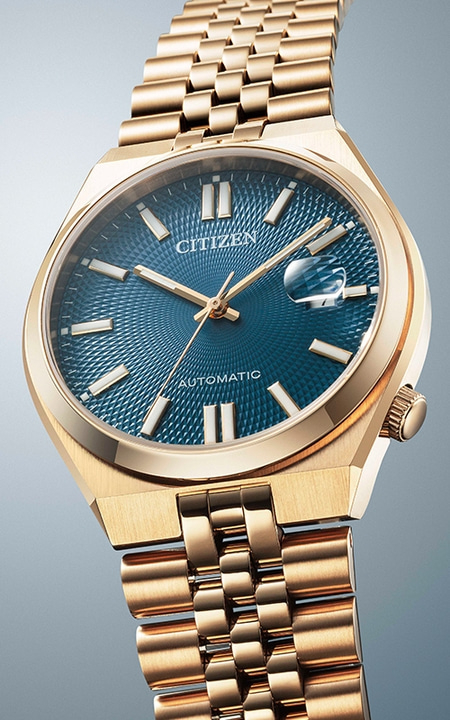Gold Citizen watch with a blue dial and gold bracelet.
