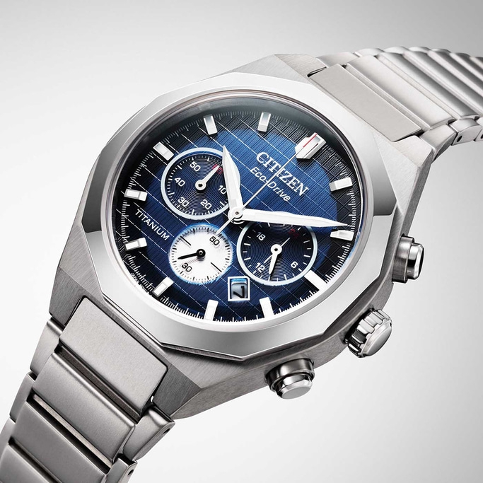 Citizen Eco-Drive titanium watch with blue face and chronograph features.