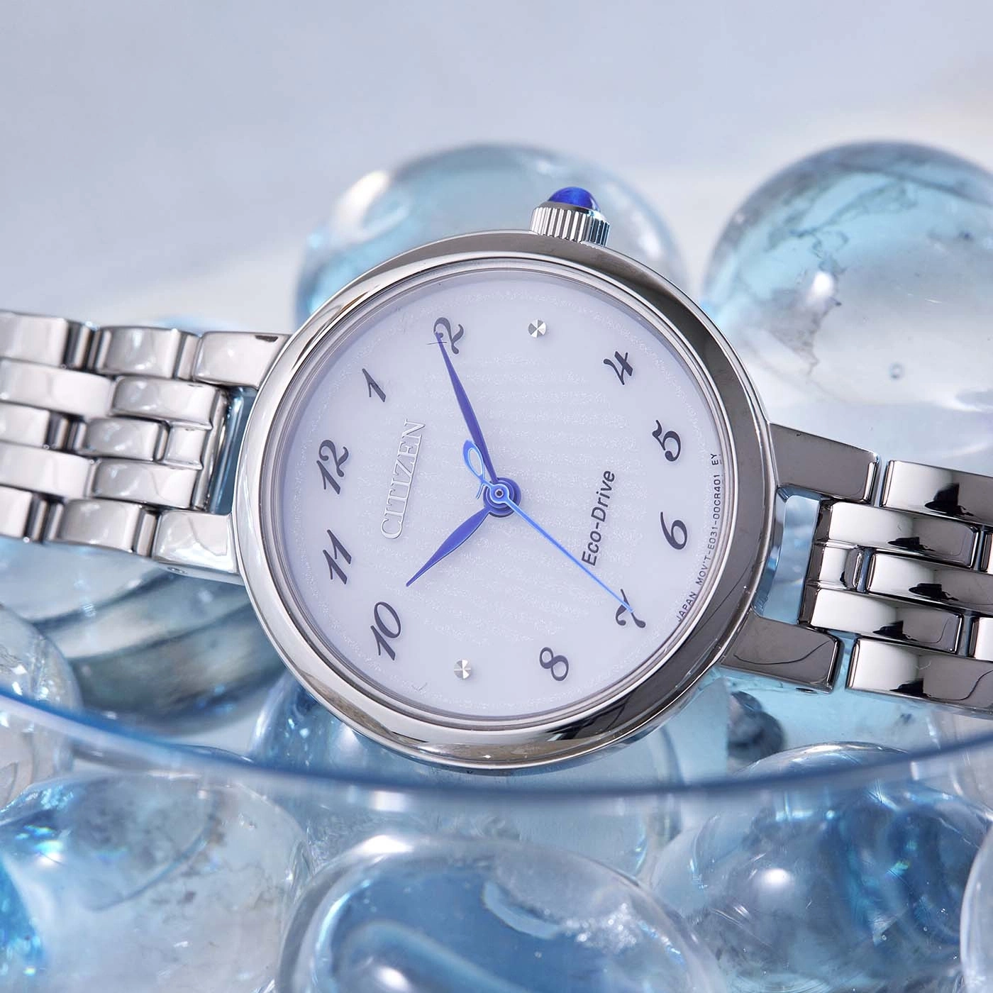 Citizen Eco-Drive watch with blue hands and a silver band on glass beads.