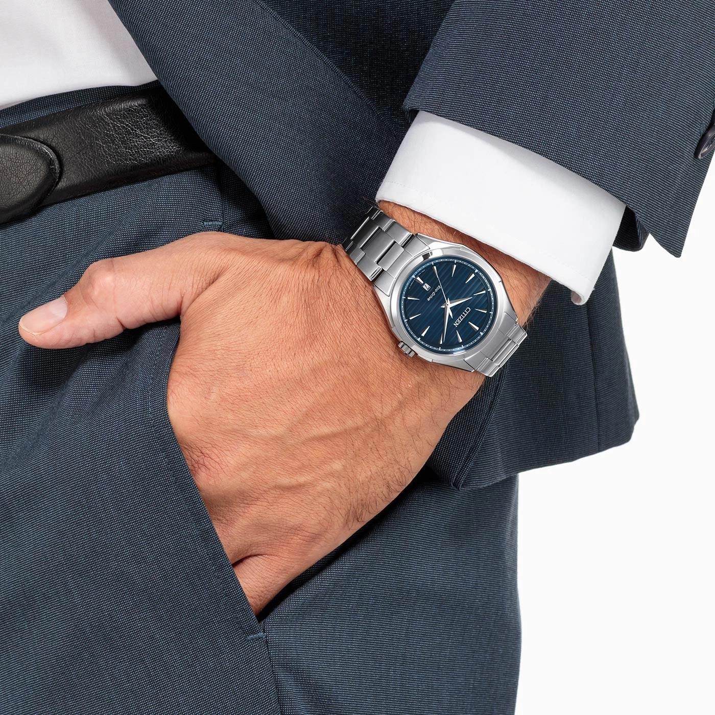 Man in suit with watch, hand in pocket, formal attire, business