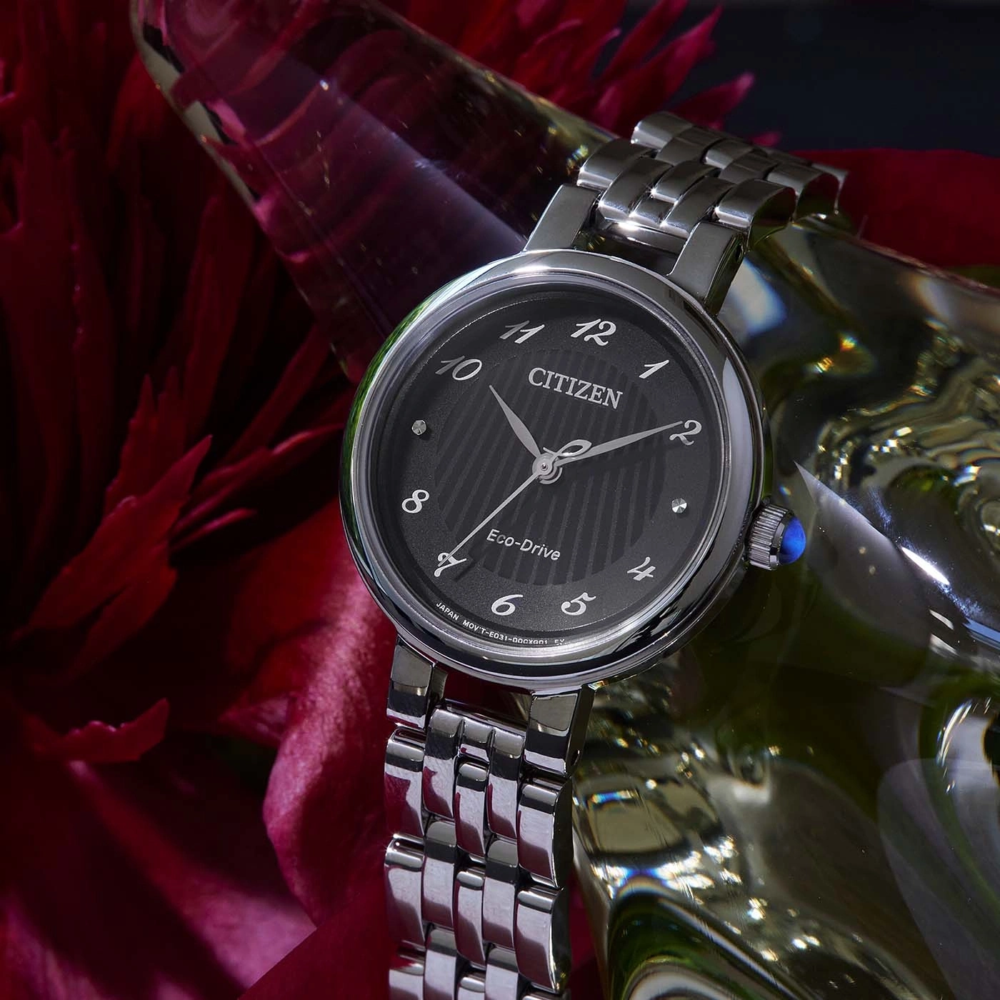 Citizen watch with black face, silver band, and Eco-Drive technology.