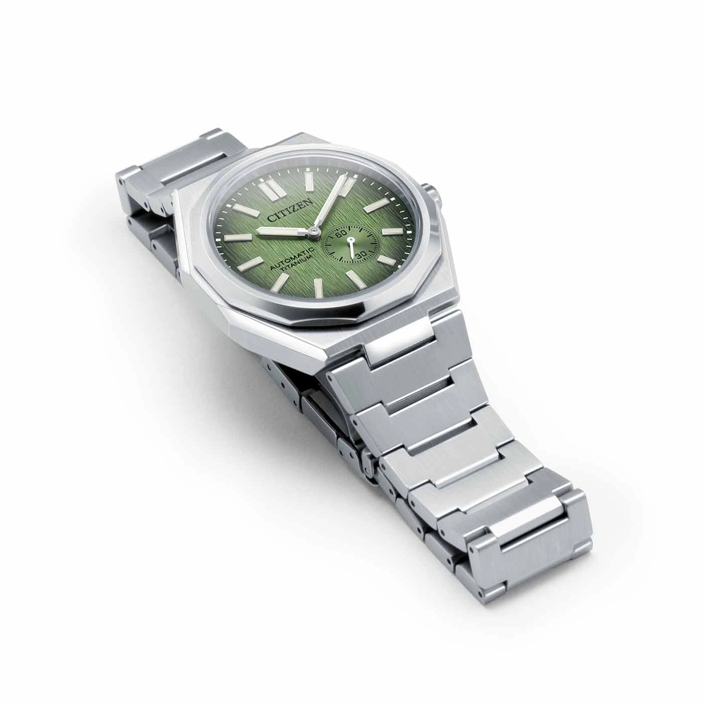 Citizen watch with green face and silver strap on white background