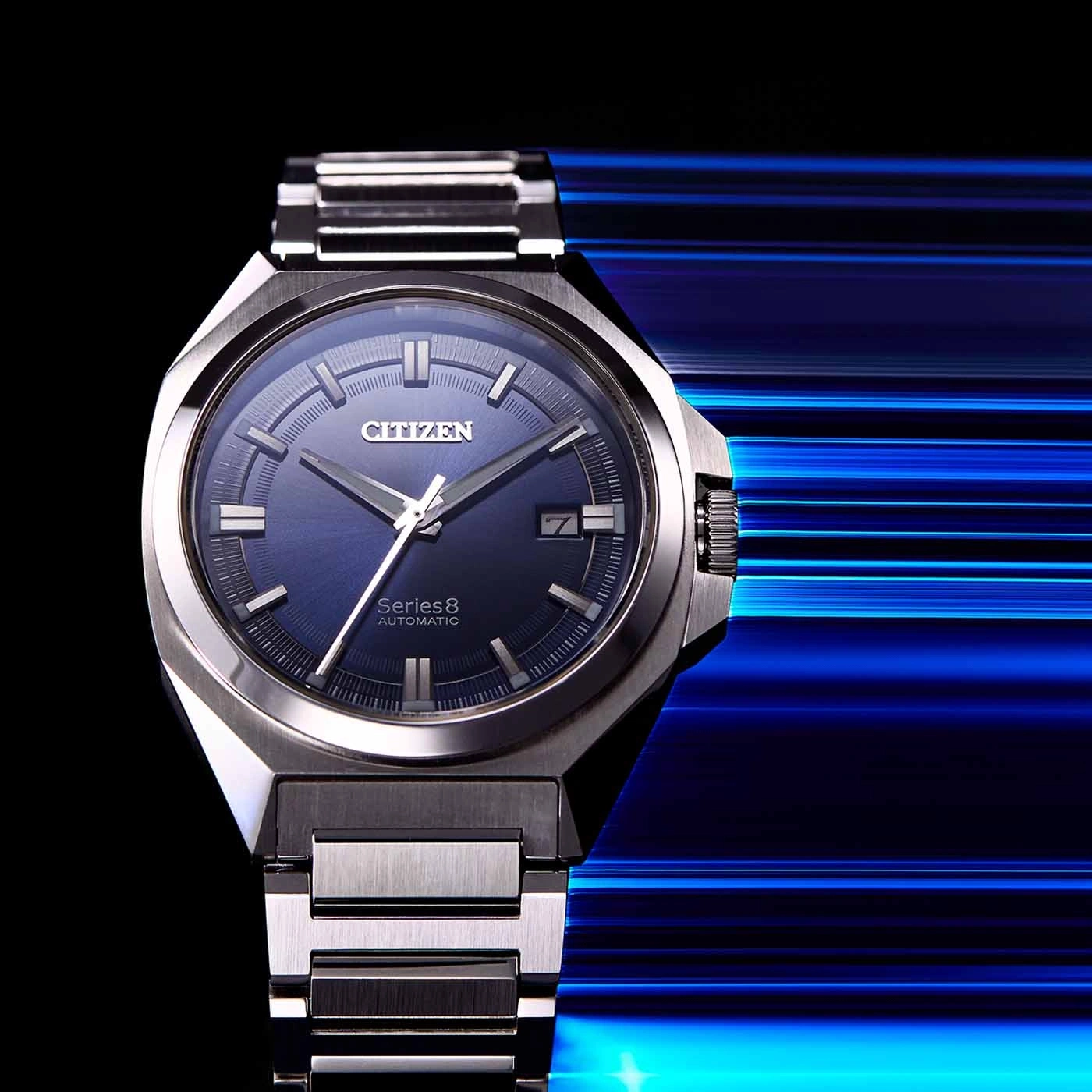 Citizen Series 8 automatic watch with blue face and metal strap.