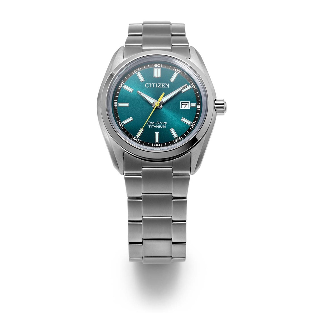 A silver Citizen Eco-Drive Titanium watch with a green dial.