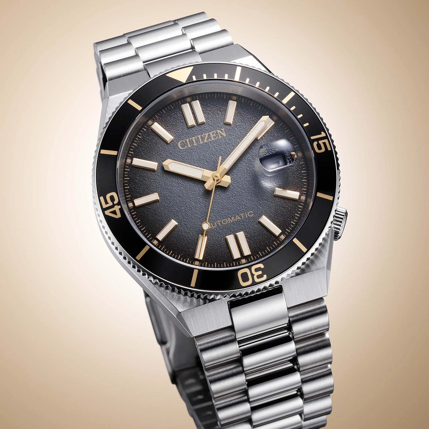 A stylish Citizen automatic watch with a black dial and gold accents.