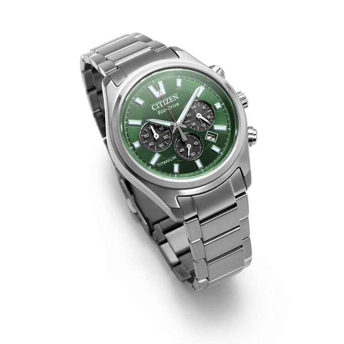 A green Citizen Eco-Drive titanium watch with a metal band.