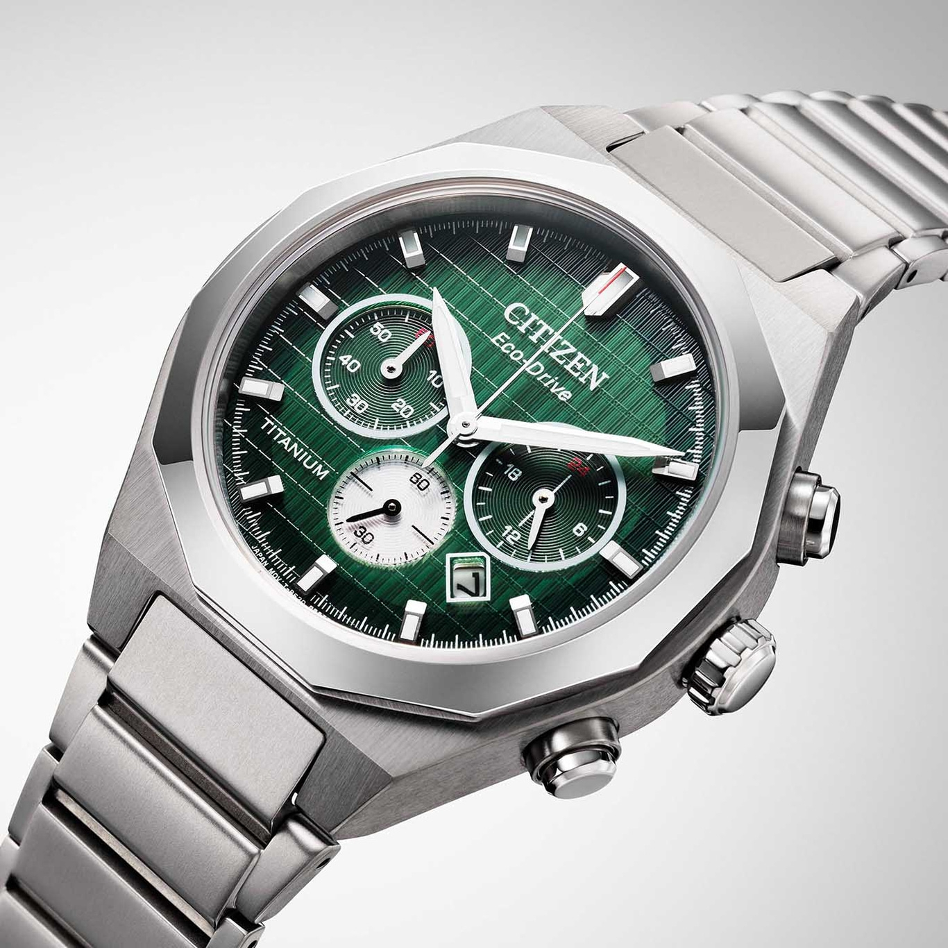 Citizen watch with green face, titanium, Eco-Drive, chronograph, stylish design.