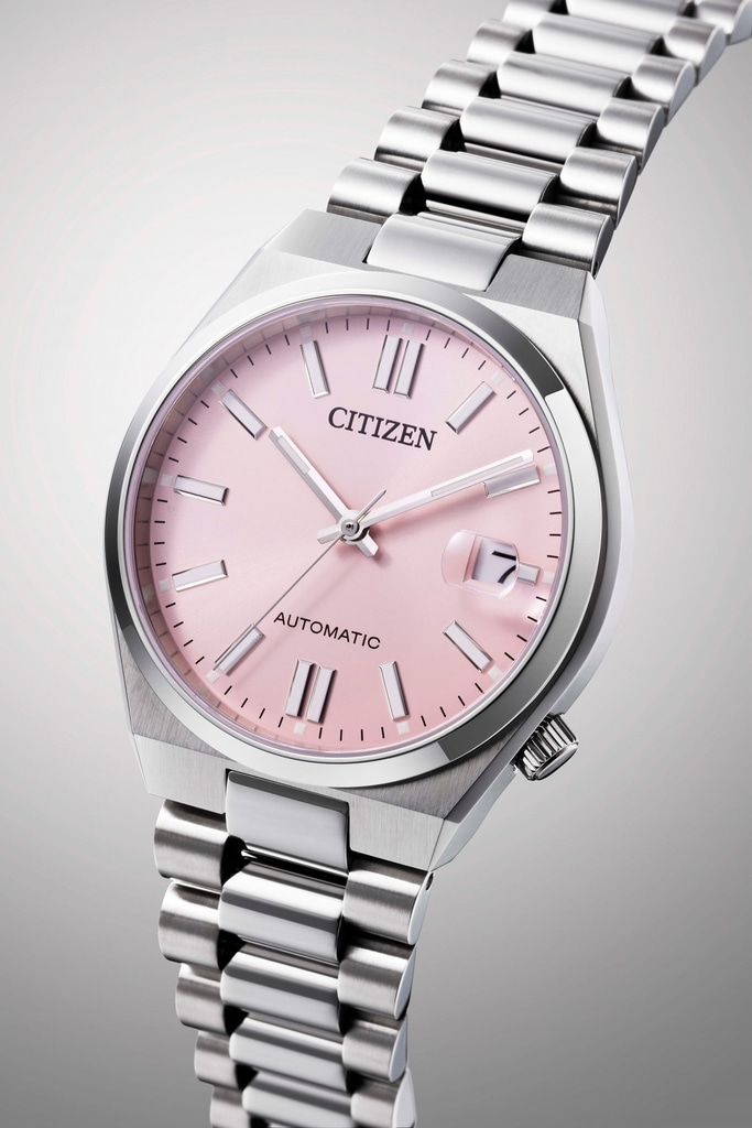 Citizen watch with pink face and silver strap, automatic movement.