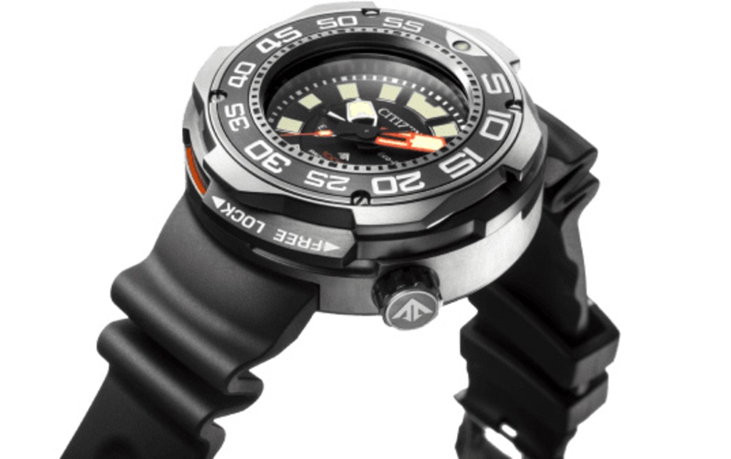 Close-up of a Citizen watch with a black rubber strap and a silver bezel.