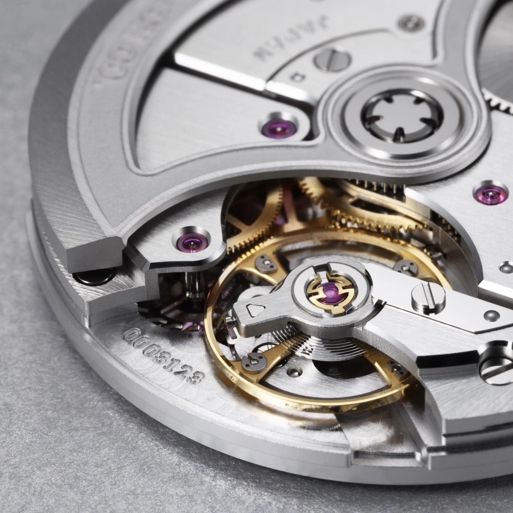 Close-up of a watch mechanism with gears and jewels, intricate details.