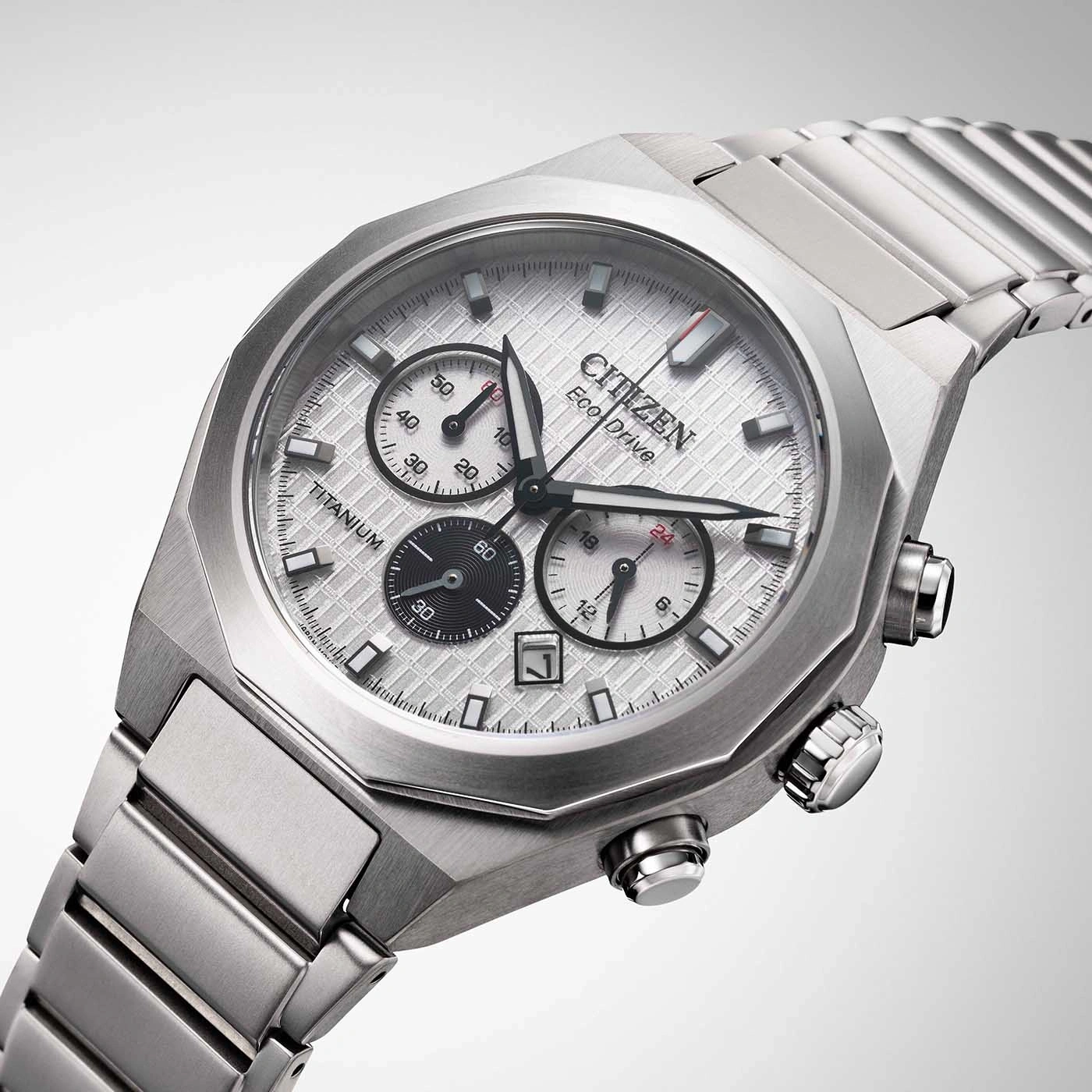 Citizen Eco-Drive titanium watch with chronograph and date display, silver dial.