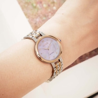Citizen watch on wrist, silver and gold, Eco-Drive, elegant design