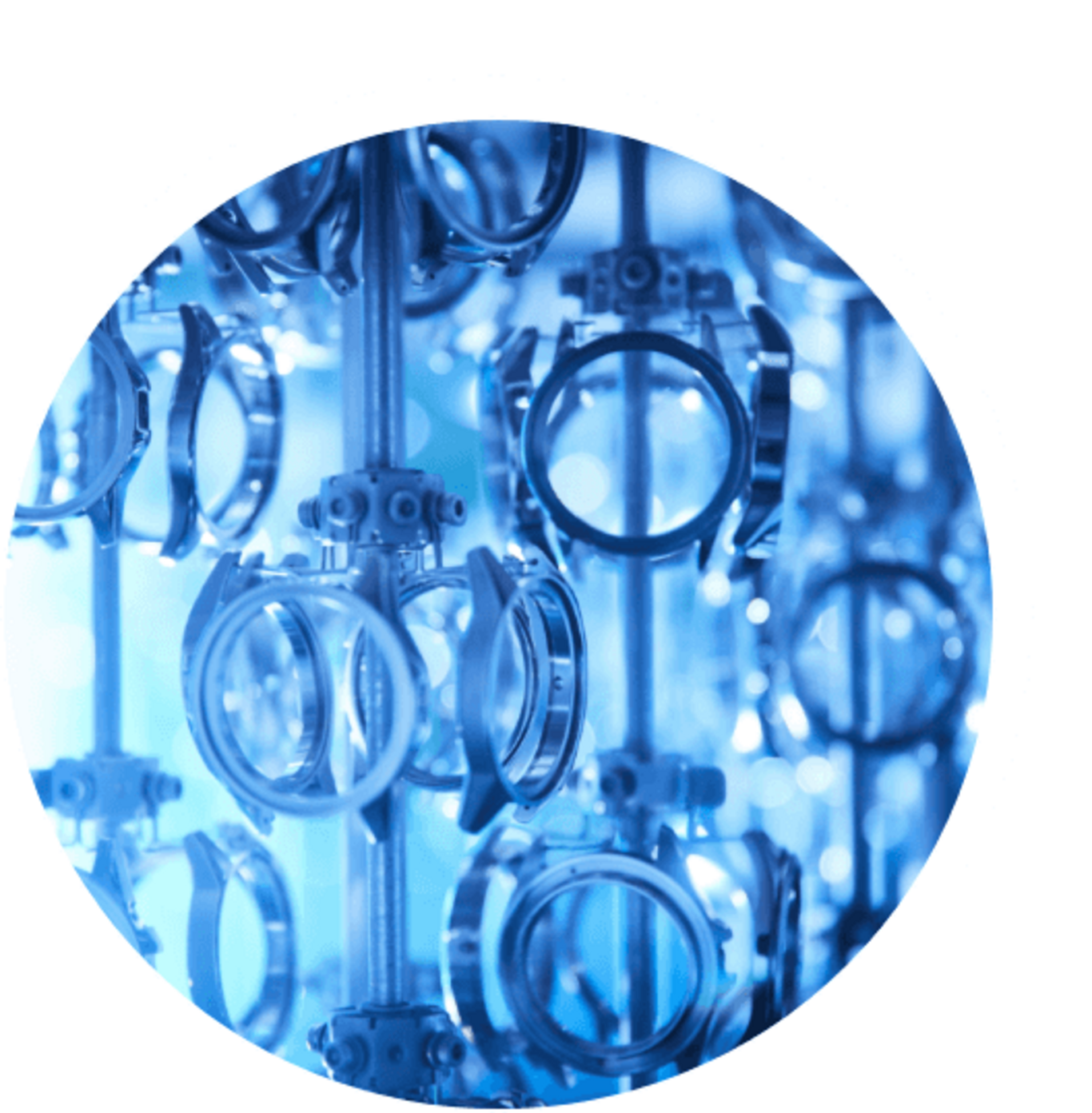 Close-up of watch parts, blue-toned, industrial, circular, metal, manufacturing process
