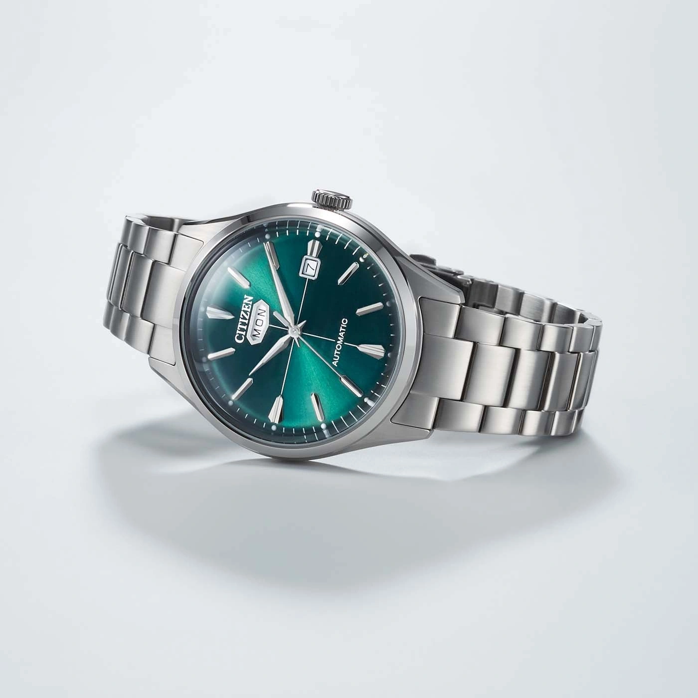 A stylish green dial Citizen automatic watch with a stainless steel band.
