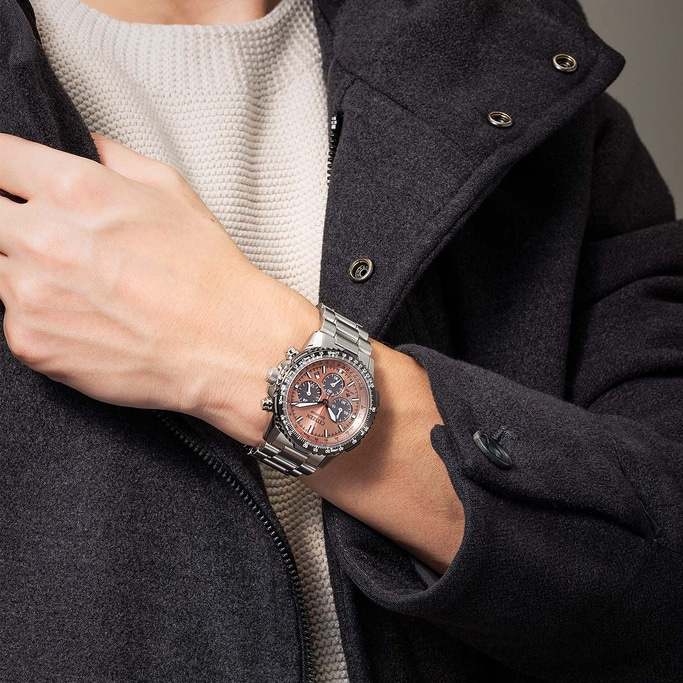 Man wearing a watch and a dark coat, close-up shot, fashion.