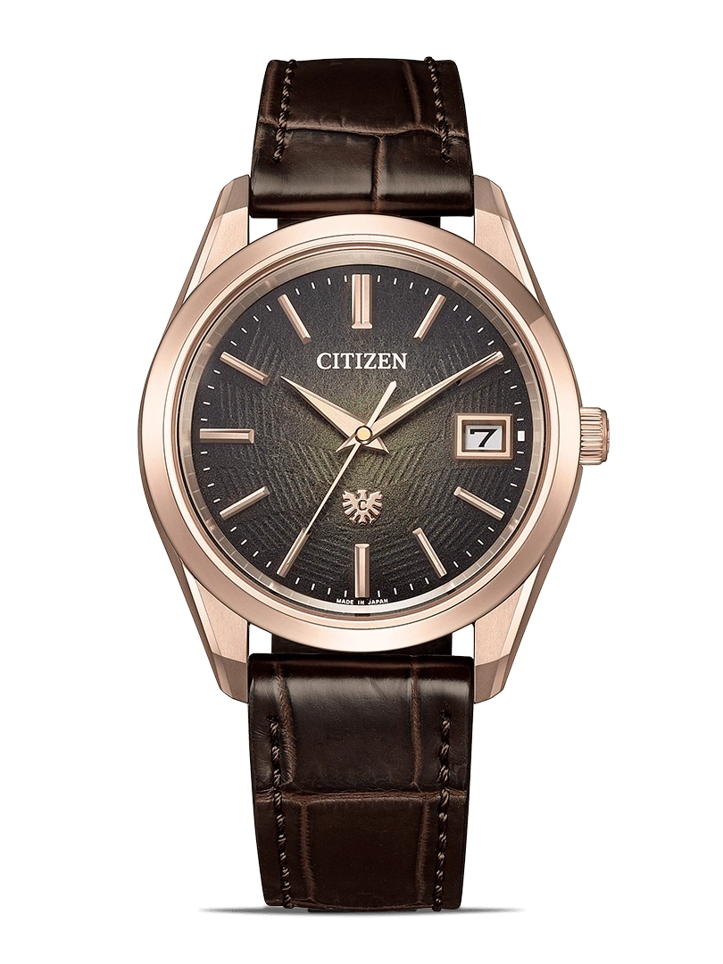 Citizen watch with a brown leather strap and a rose gold case.