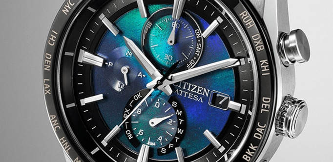 Citizen Attesa watch with a blue and green dial, time and date display.