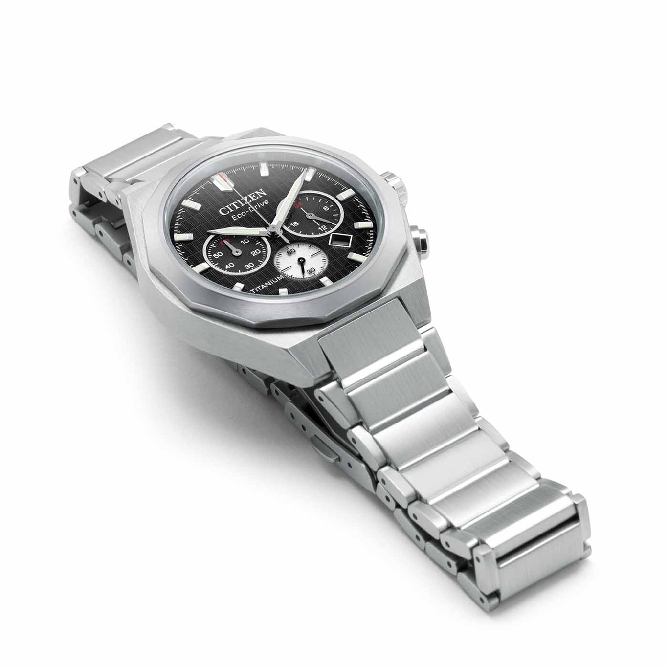 Citizen Eco-Drive titanium watch with black dial and silver bracelet.