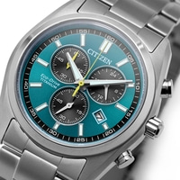 Close-up of a modern Citizen Eco-Drive titanium chronograph watch face with a teal dial.