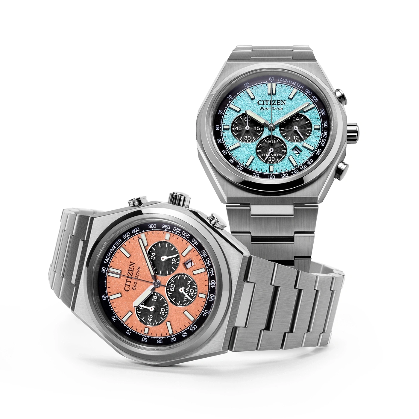 Two Citizen Eco-Drive watches with titanium bracelets and colorful dials.