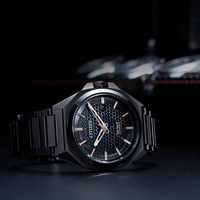 Black Citizen watch with a patterned dial and a black bracelet.