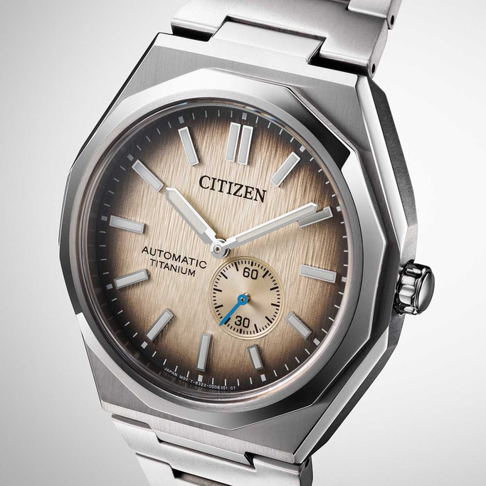 Citizen watch with a titanium automatic movement and a brown dial.