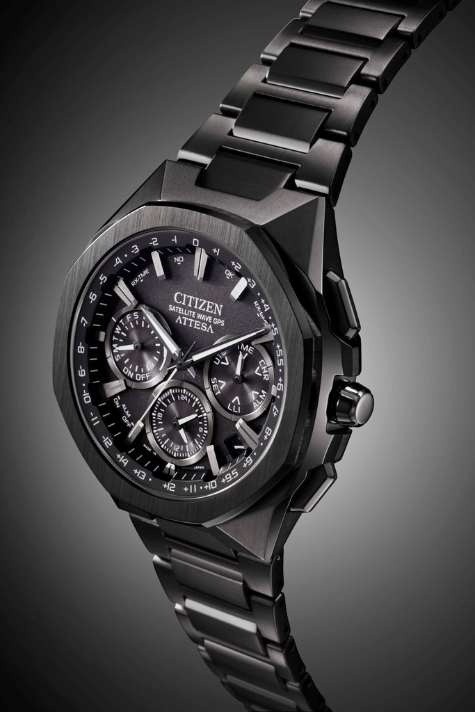 Black Citizen Attesa watch with multiple dials and a metallic strap, close-up shot.