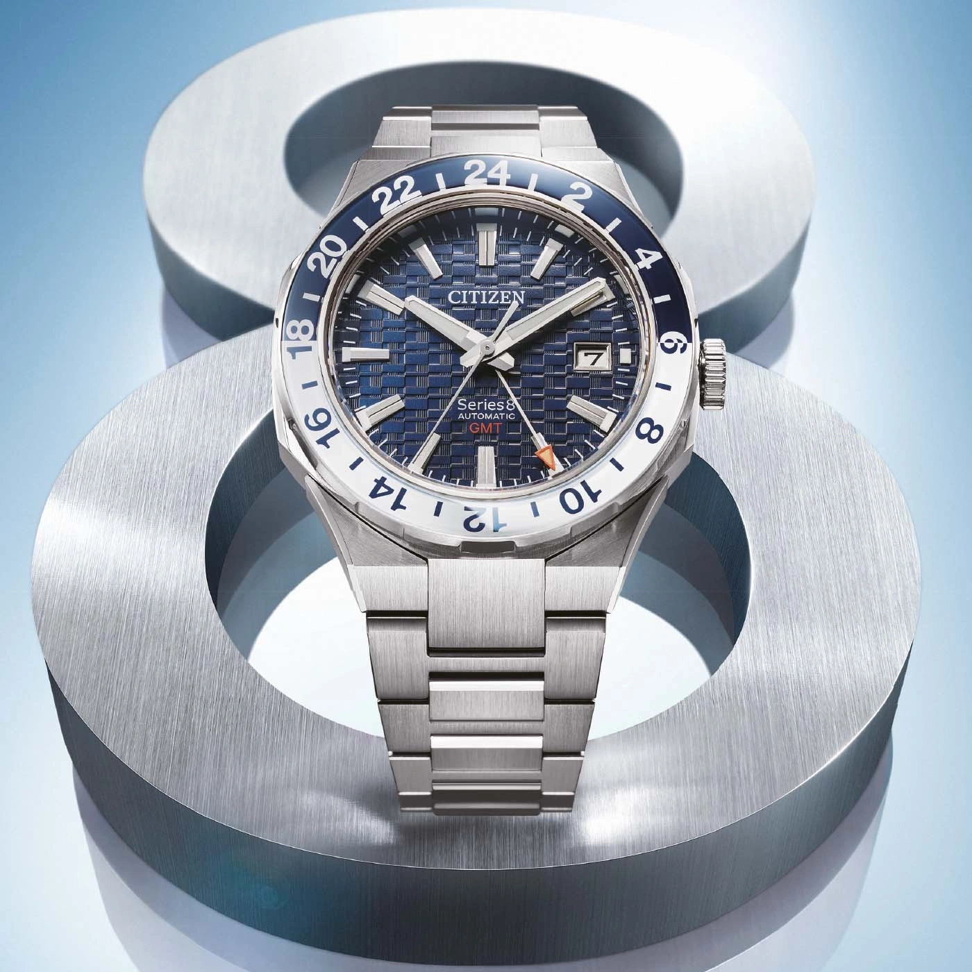 Citizen Series 8 automatic GMT watch on a metallic background