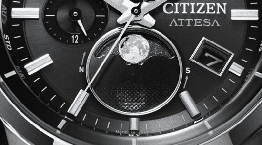 Close-up of a Citizen Attesa watch with moon phase and date display.