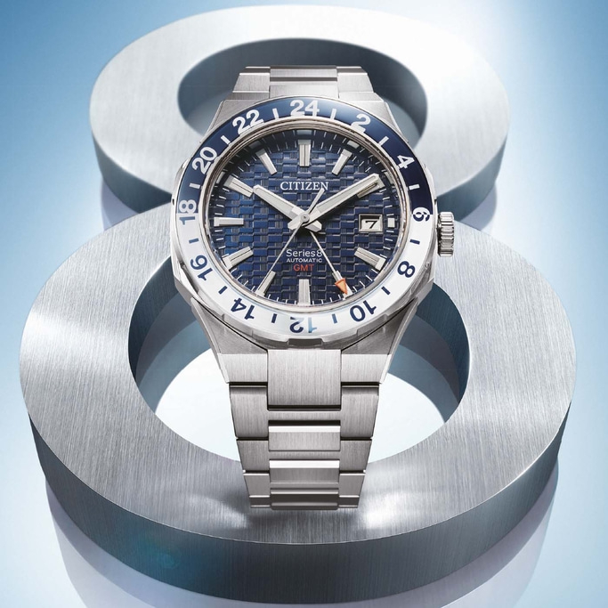Citizen Series 8 automatic GMT watch on a metallic background