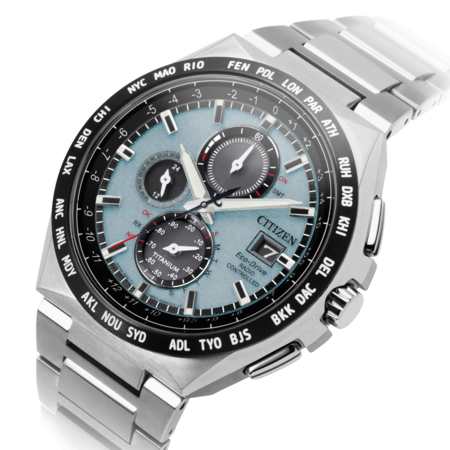 Citizen watch with a blue face, titanium, and world time zones.