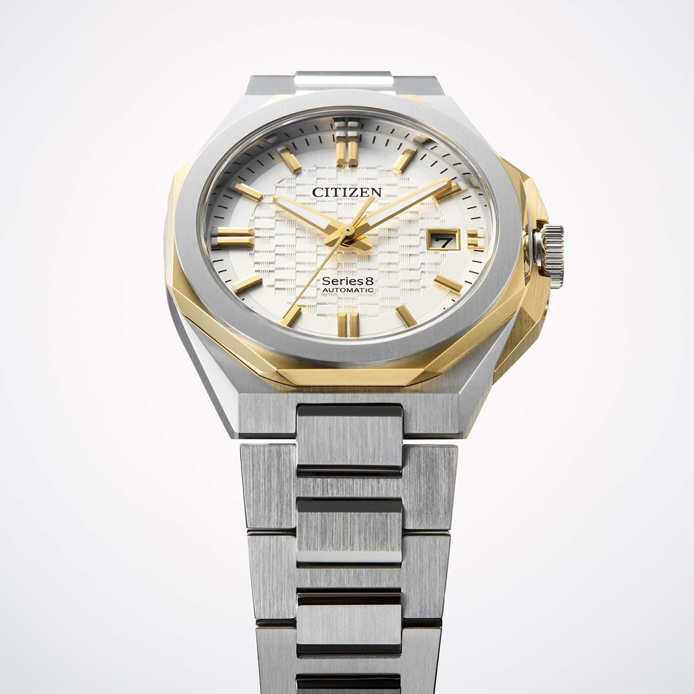 A Citizen Series8 automatic watch with a silver and gold case and bracelet.