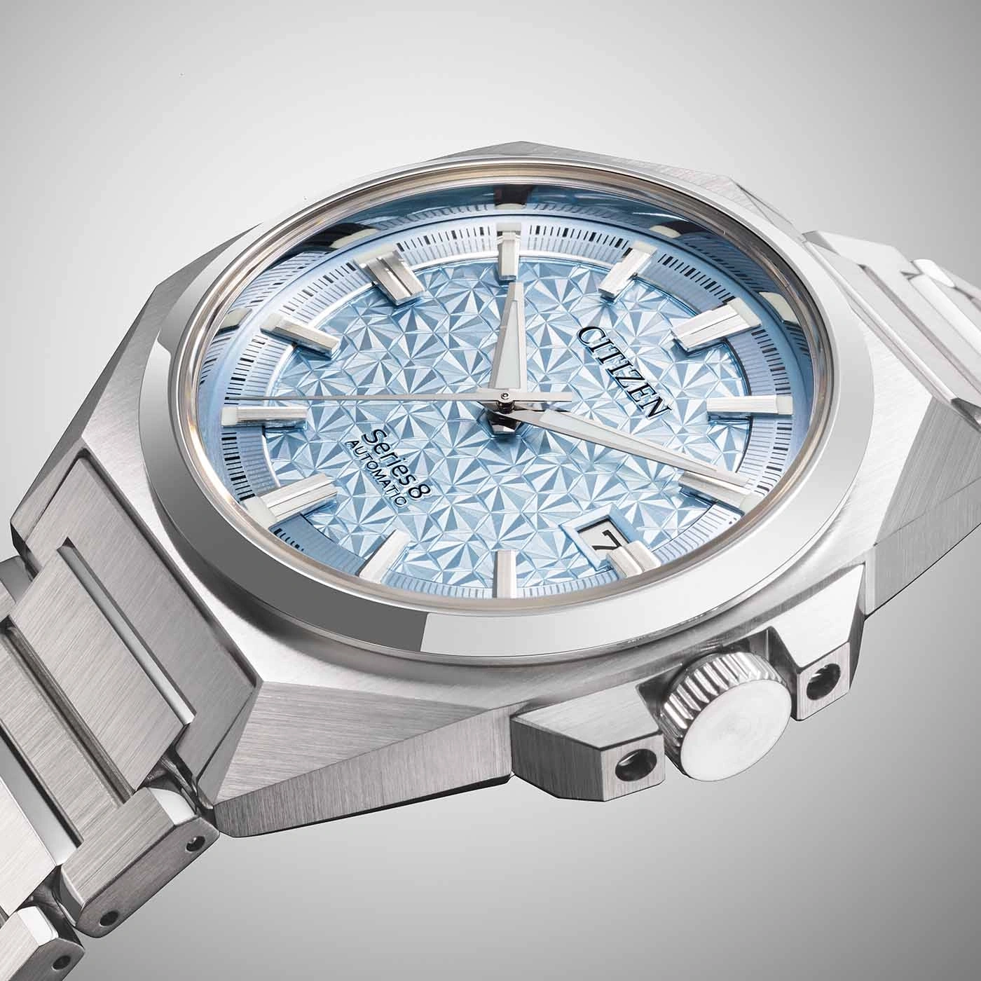 Citizen Series 8 automatic watch with a light blue dial and silver bracelet.