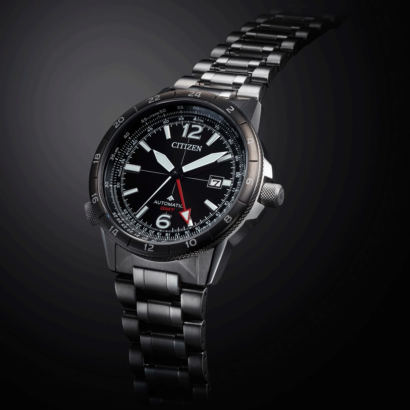 Citizen watch with black face, GMT, automatic, stainless steel band, and date display.