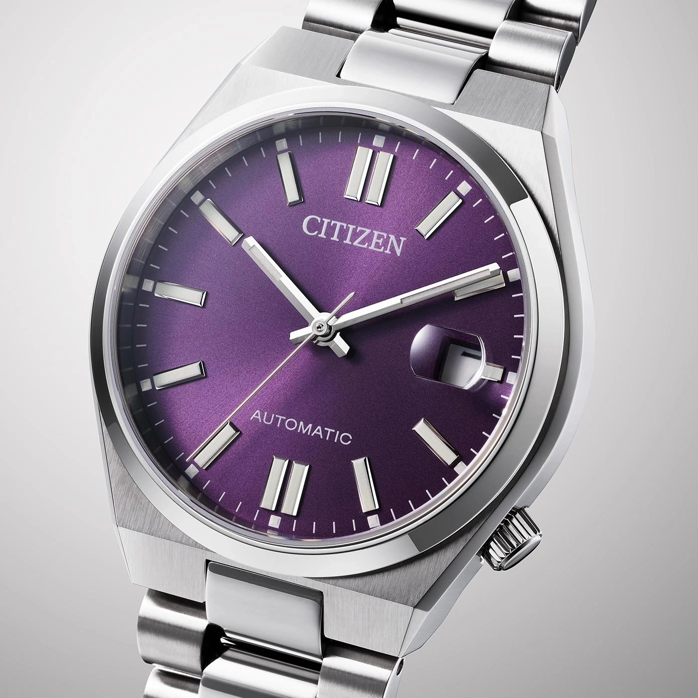 Citizen watch with purple face and silver band, automatic movement.