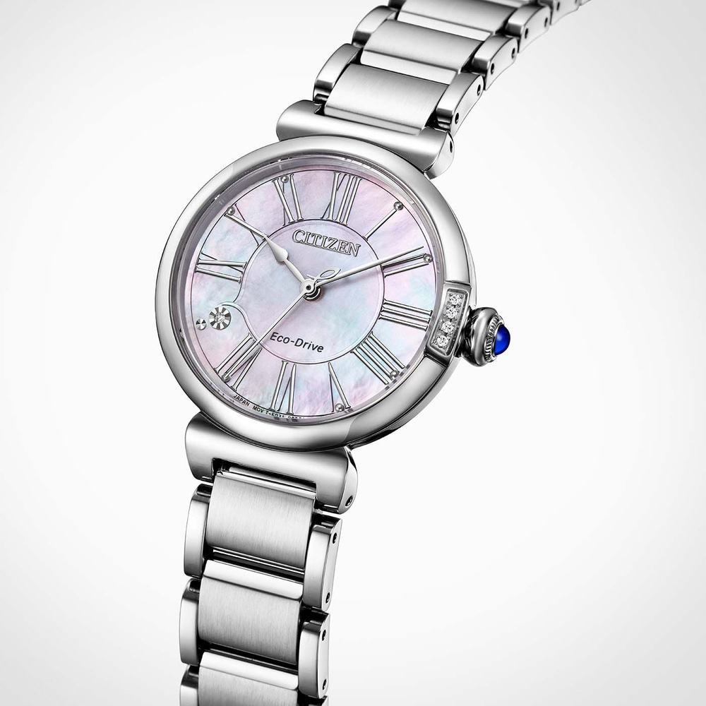 A close-up shot of a Citizen Eco-Drive watch with a mother-of-pearl dial and Roman numerals.