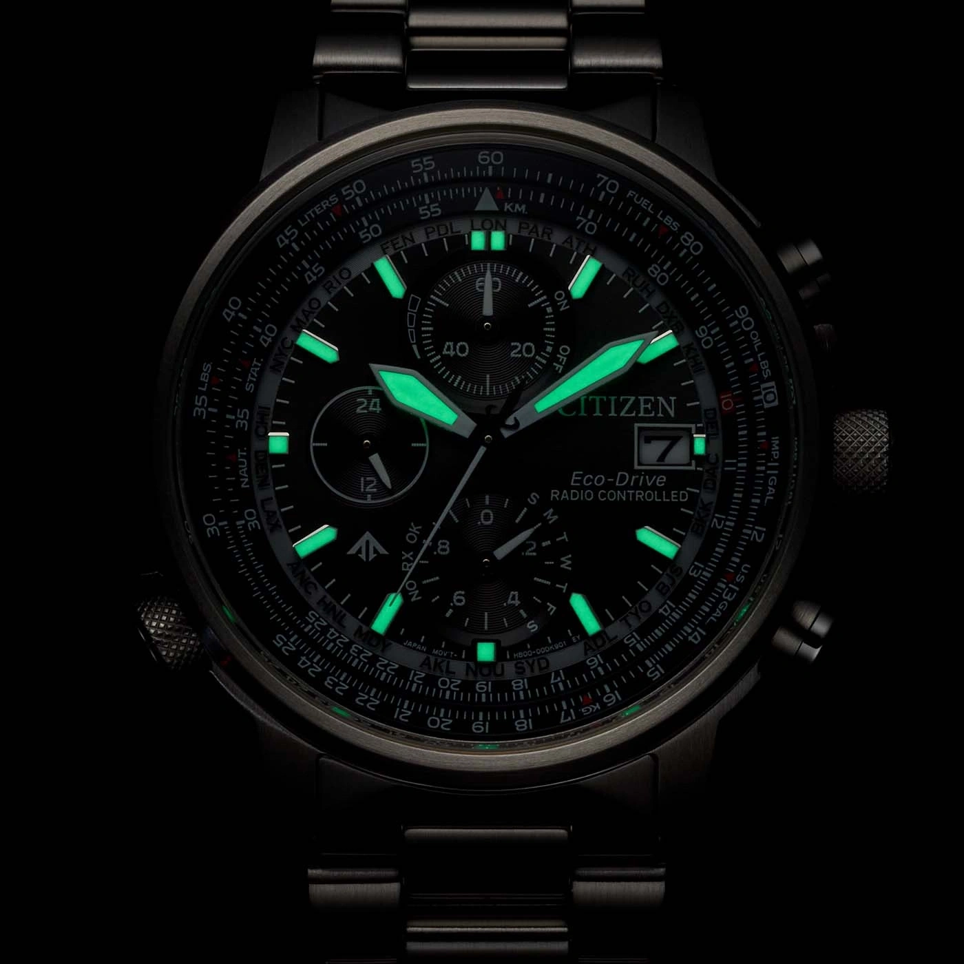Close-up of a Citizen watch with glowing green accents and intricate details.