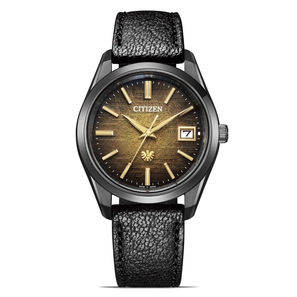 Citizen watch with a black strap and a golden face, date display.