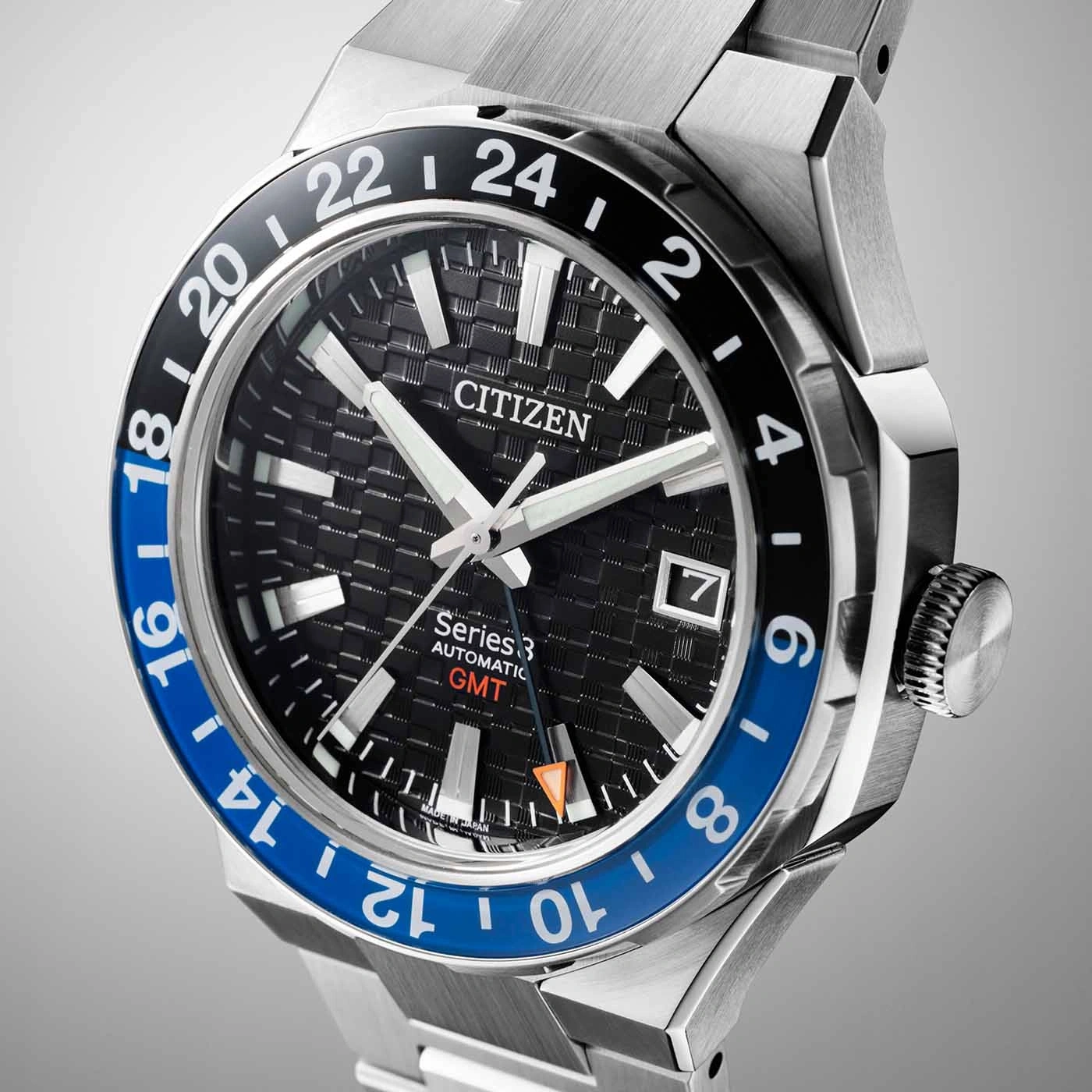 Citizen Series 3 GMT watch with black and blue bezel and date display.