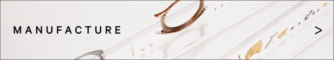 Manufacture text with an arrow, glasses parts on white background.