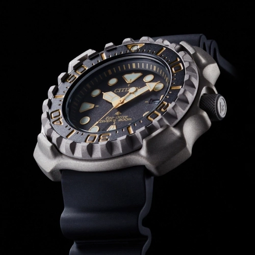 Close-up of a Citizen Eco-Drive diver's watch with a black strap.