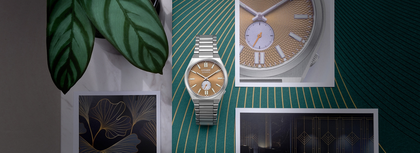Watch on green background with leaves and art prints