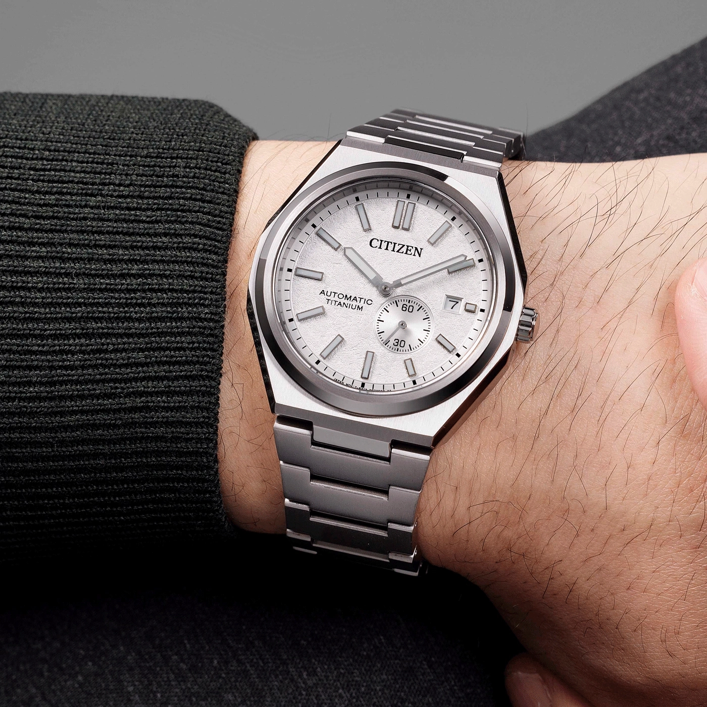 Citizen watch on wrist, silver, automatic, titanium, elegant, modern design, close-up shot