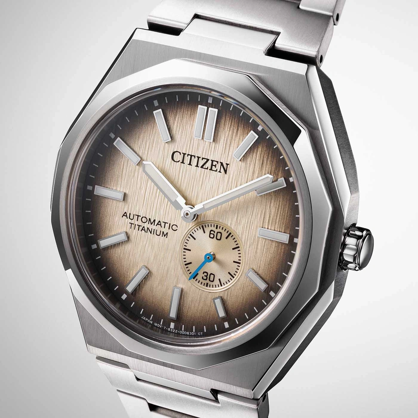 Citizen watch with a titanium automatic movement and a brown dial.