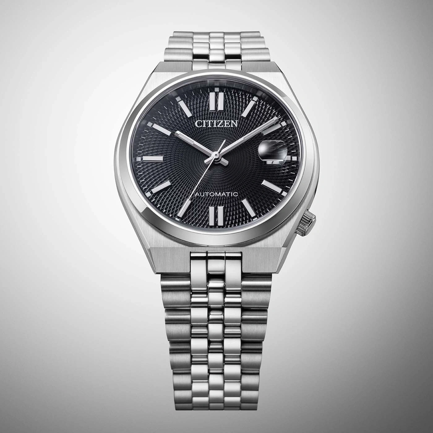 A Citizen automatic watch with a black dial and stainless steel band.
