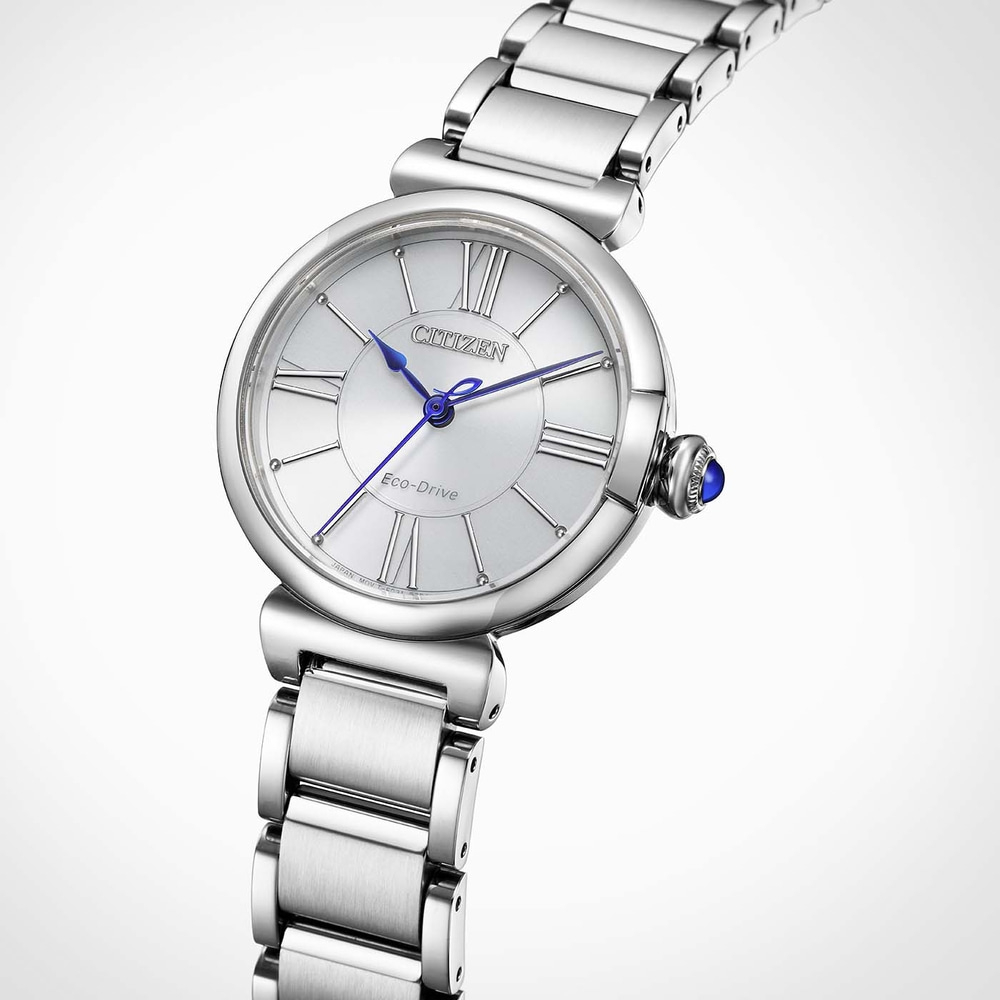 A silver Citizen Eco-Drive watch with blue hands and a blue gem on the crown.
